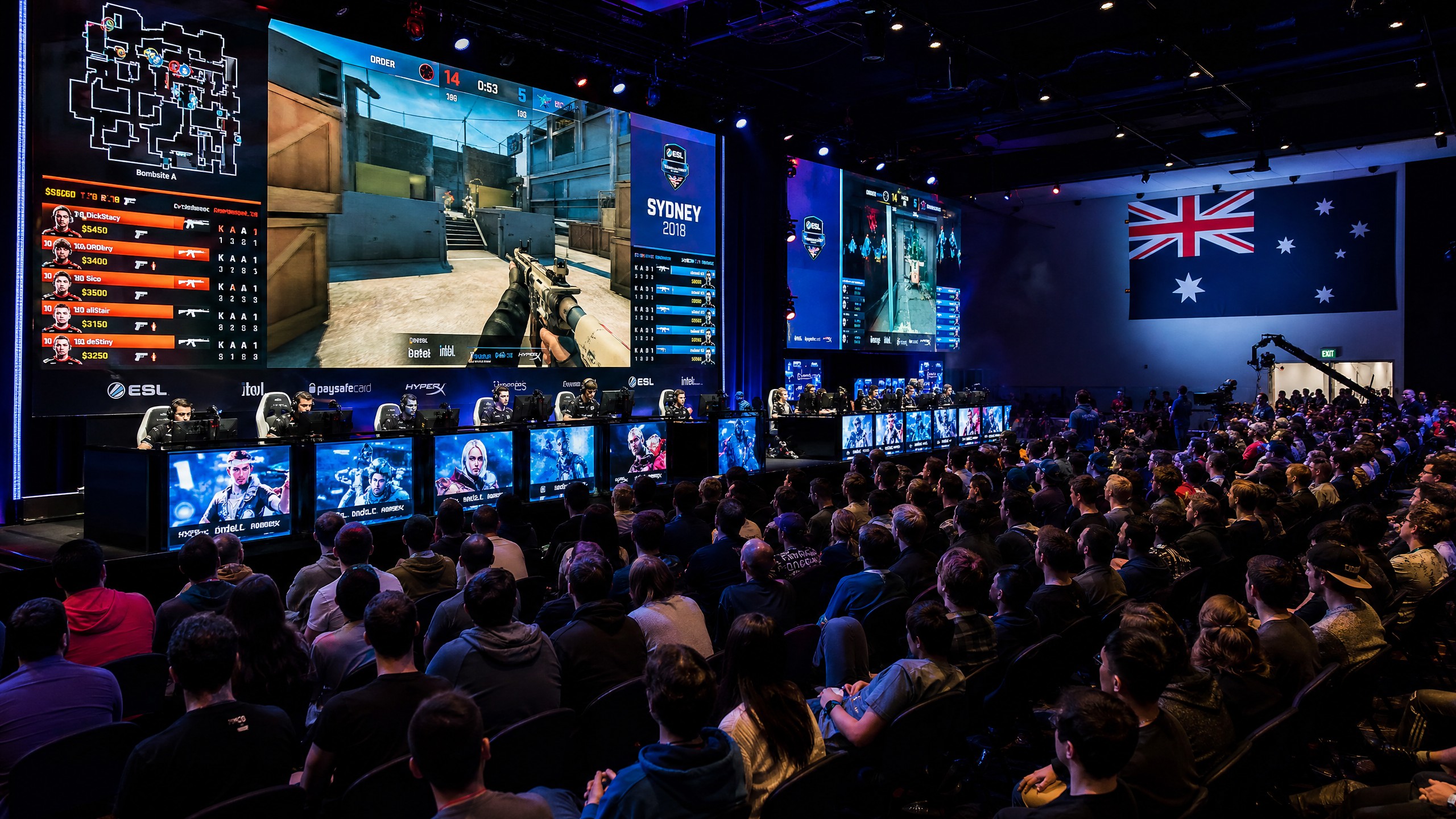 Australian esports tournament event with large LED screens and crowd